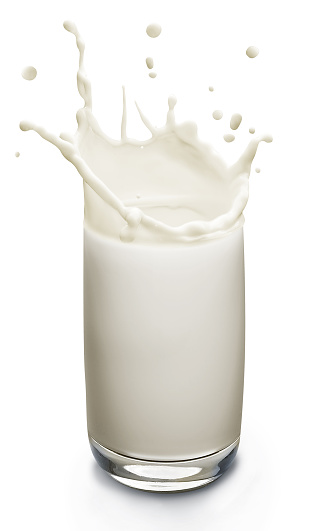 A class of milk splashing out of the top