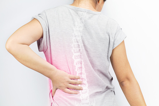 Person suffering with spinal pain