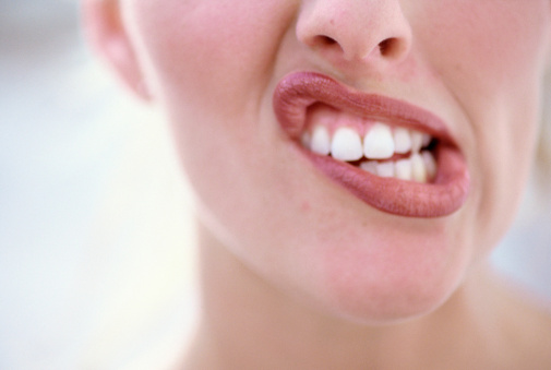 A woman making a funny shape with her mouth