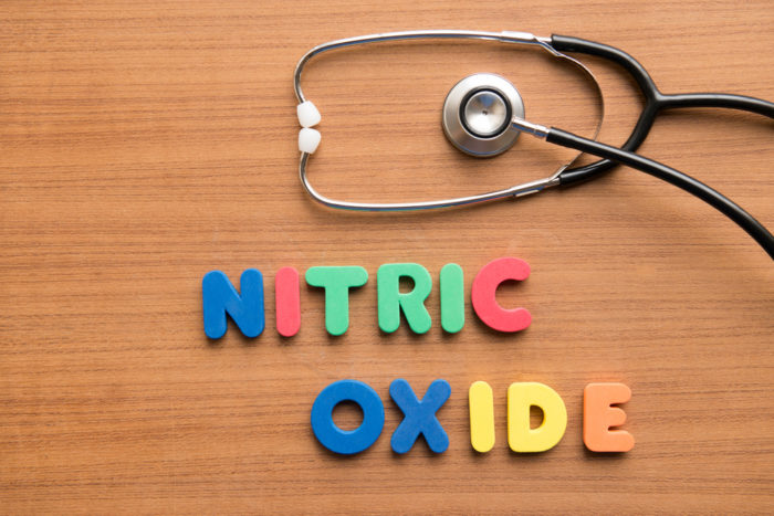 Nitric Oxide spelled out in fridge magnets next to a stethoscope