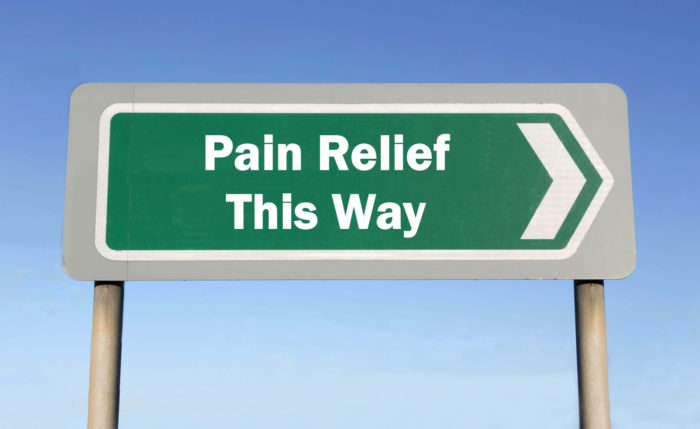 Sign saying "Pain Relief This Way"