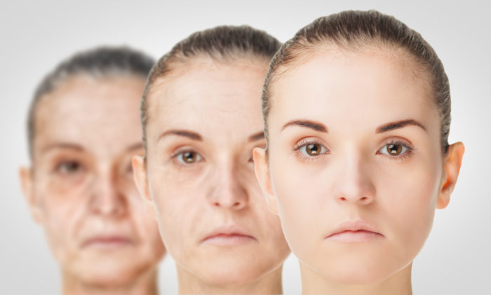 Young woman standing Infront of her two increasingly older-selves