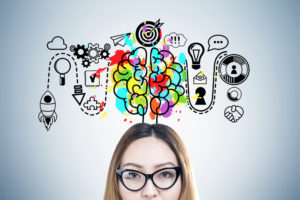 Woman with a colourful brain diagram above her head